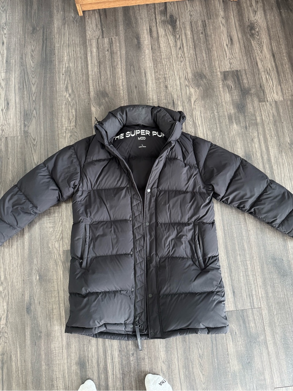 The Super Puff Mid Puffer Jacket in Matte Black